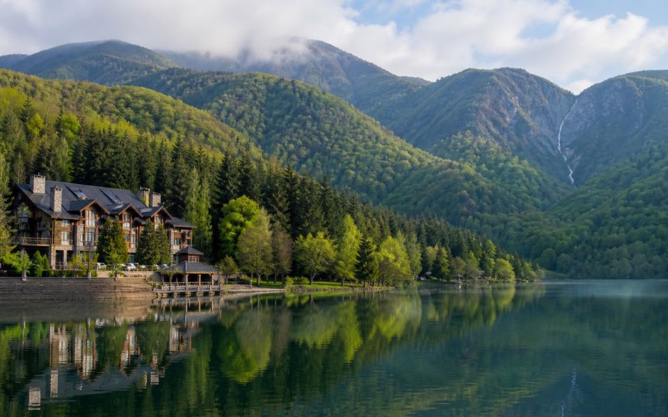 Lake Nokhur, the green Caucasus Mountains, and the resort hotels of Gabala