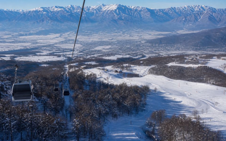 Cable car, wooded slopes and snowy trails of Tufandag near Gabala