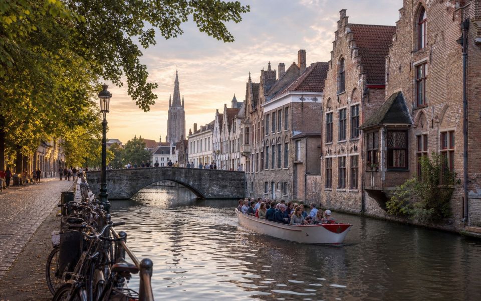Medieval canal, stone bridge and historic facades of Bruges