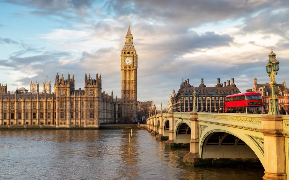 Westminster, Elizabeth Tower, the Thames and a red bus in London