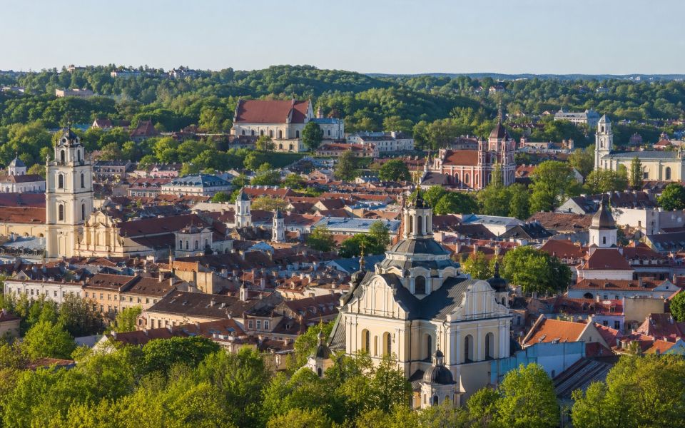 Baroque churches, red roofs and green hills of Vilnius Old Town