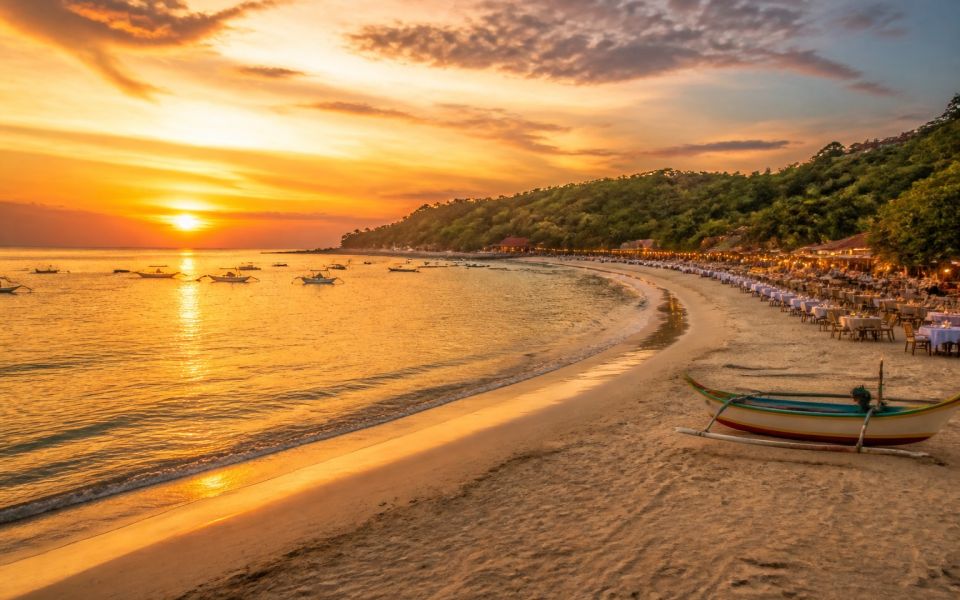 Golden sunsets, fishing boats, and beach restaurants in Jimbaran, Bali