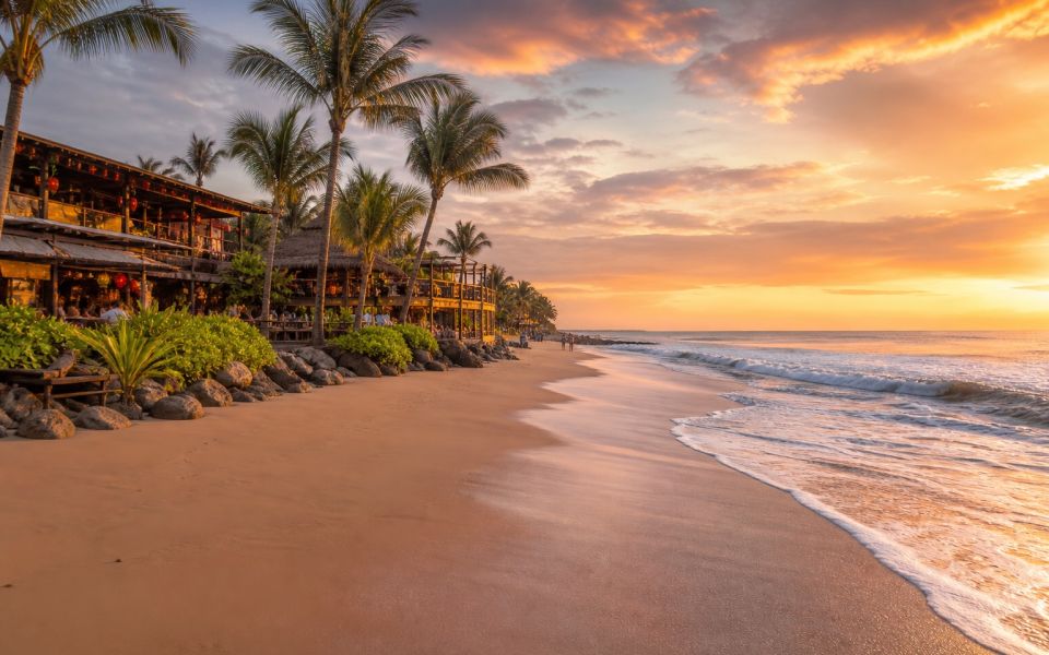 Sunset on Seminyak Beach, modern cafes and a tropical resort street in Bali