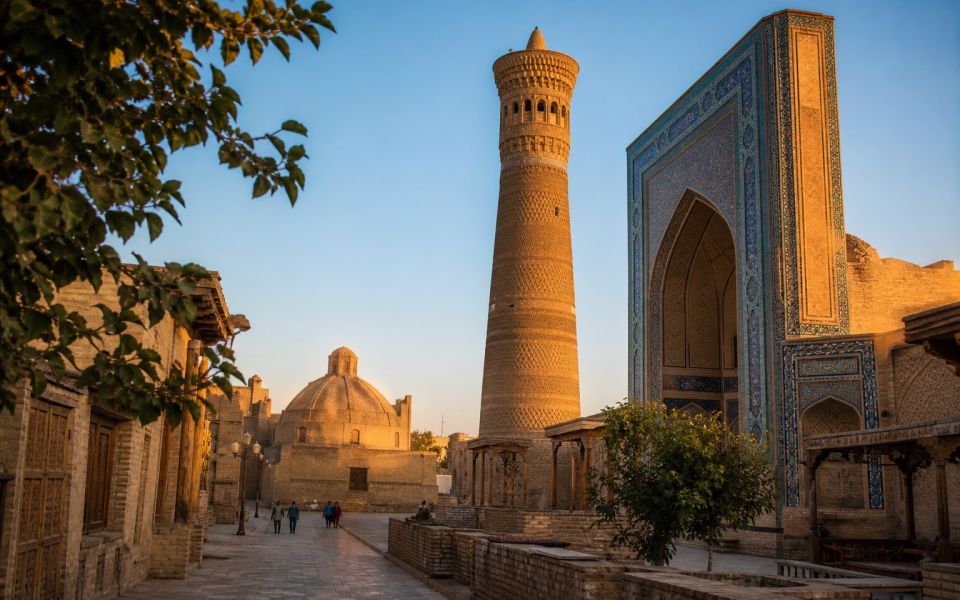 The Kalyan Minaret, madrassah, and historic streets of Bukhara in the evening light