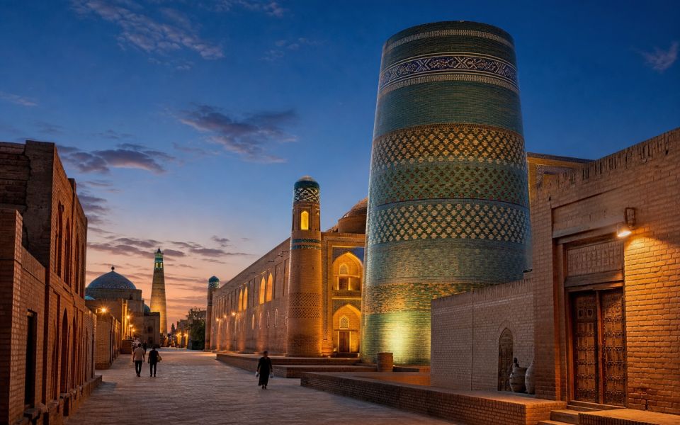 Kalta-Minor and the illuminated streets of Ichan-Kala in Khiva after sunset
