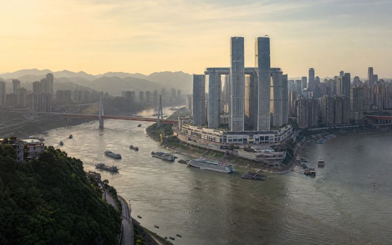 The Yangtze and Jialing rivers merge among the bridges and skyscrapers of Chongqing