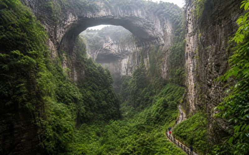 The stone arches and green gorge of the Wulong Natural Bridges near Chongqing