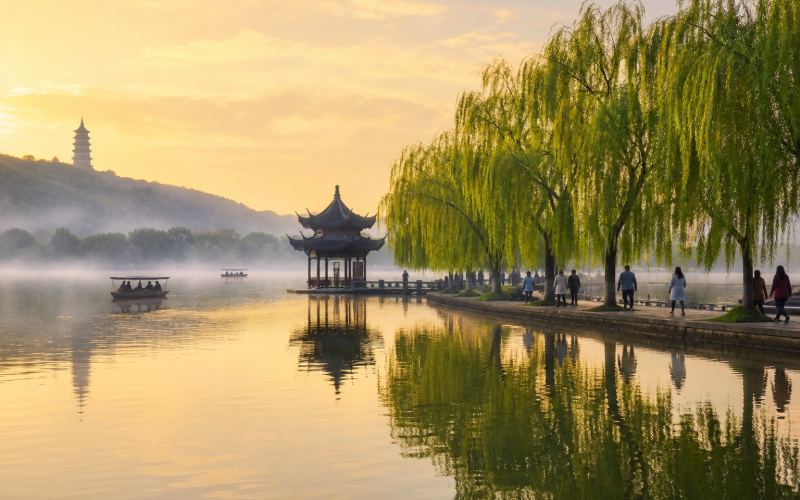 West Lake, willows, and Leifeng Pagoda in Hangzhou in the morning