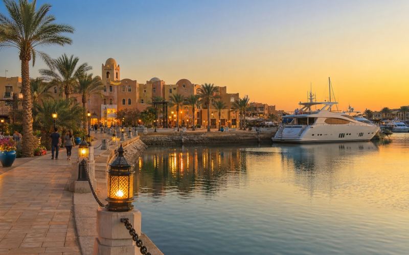 Yachts, palm trees, and the evening promenade of Port Ghalib near Marsa Alam