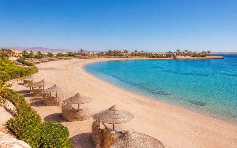 The wide white beach and tranquil turquoise bay of Soma Bay