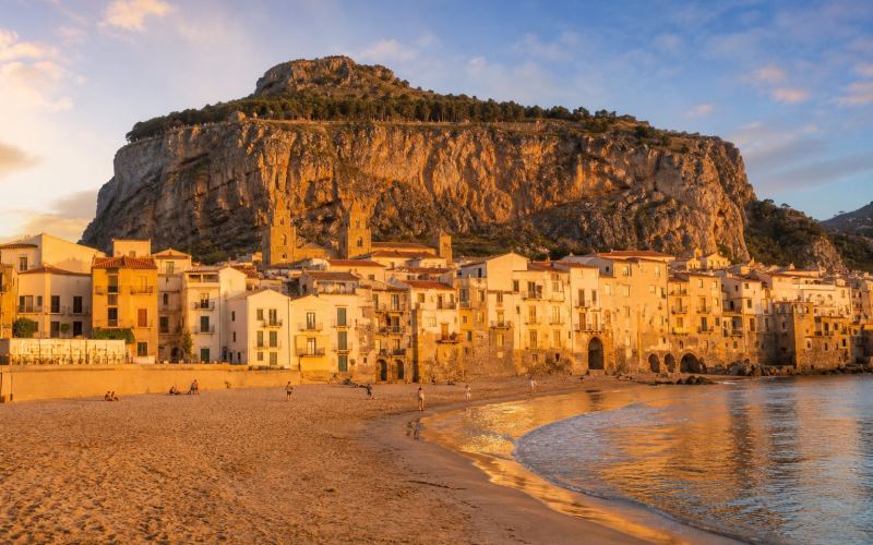 The beach, the old town and the cathedral of Cefalù at La Rocca