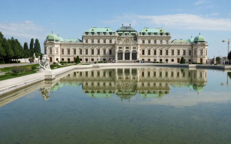 The Belvedere Palace is reflected in Vienna's garden pool