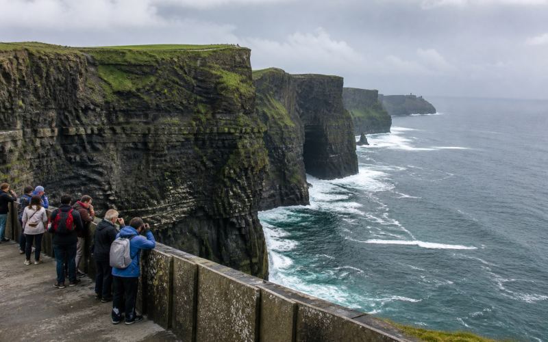 The green Cliffs of Moher overlooking the Atlantic Ocean
