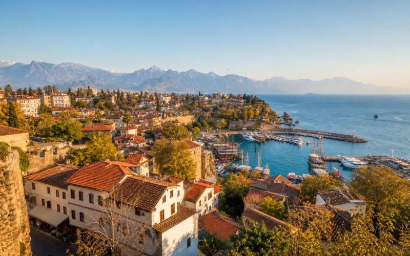 Antalya's old town of Kaleici and historic harbor against the backdrop of the Taurus Mountains