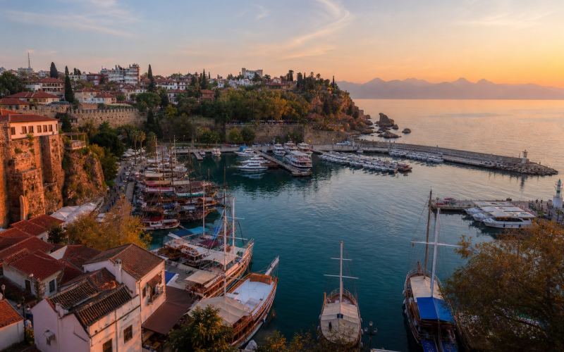 Antalya's historic marina and old city walls in the evening light
