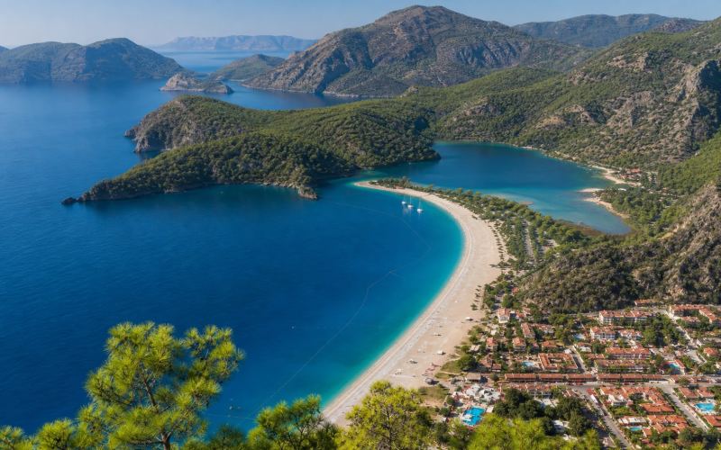 Oludeniz's Blue Lagoon, sandbar and forested mountains near Fethiye