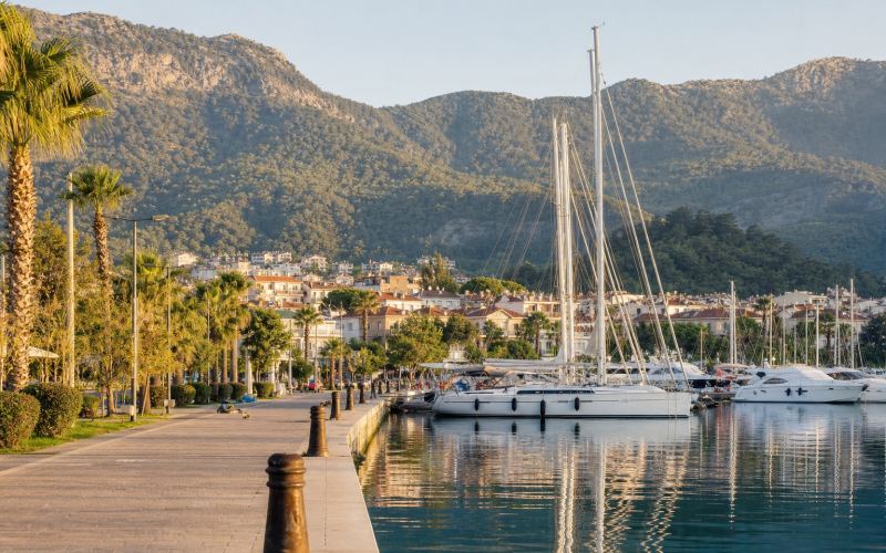 Sailing yachts in Fethiye Marina against the backdrop of green mountains