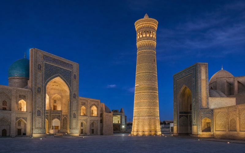 The Kalyan Minaret, mosque, and madrasah of the Poi-Kalyan ensemble illuminated at night