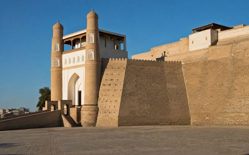 The massive walls and entrance towers of the Ark Fortress in Bukhara